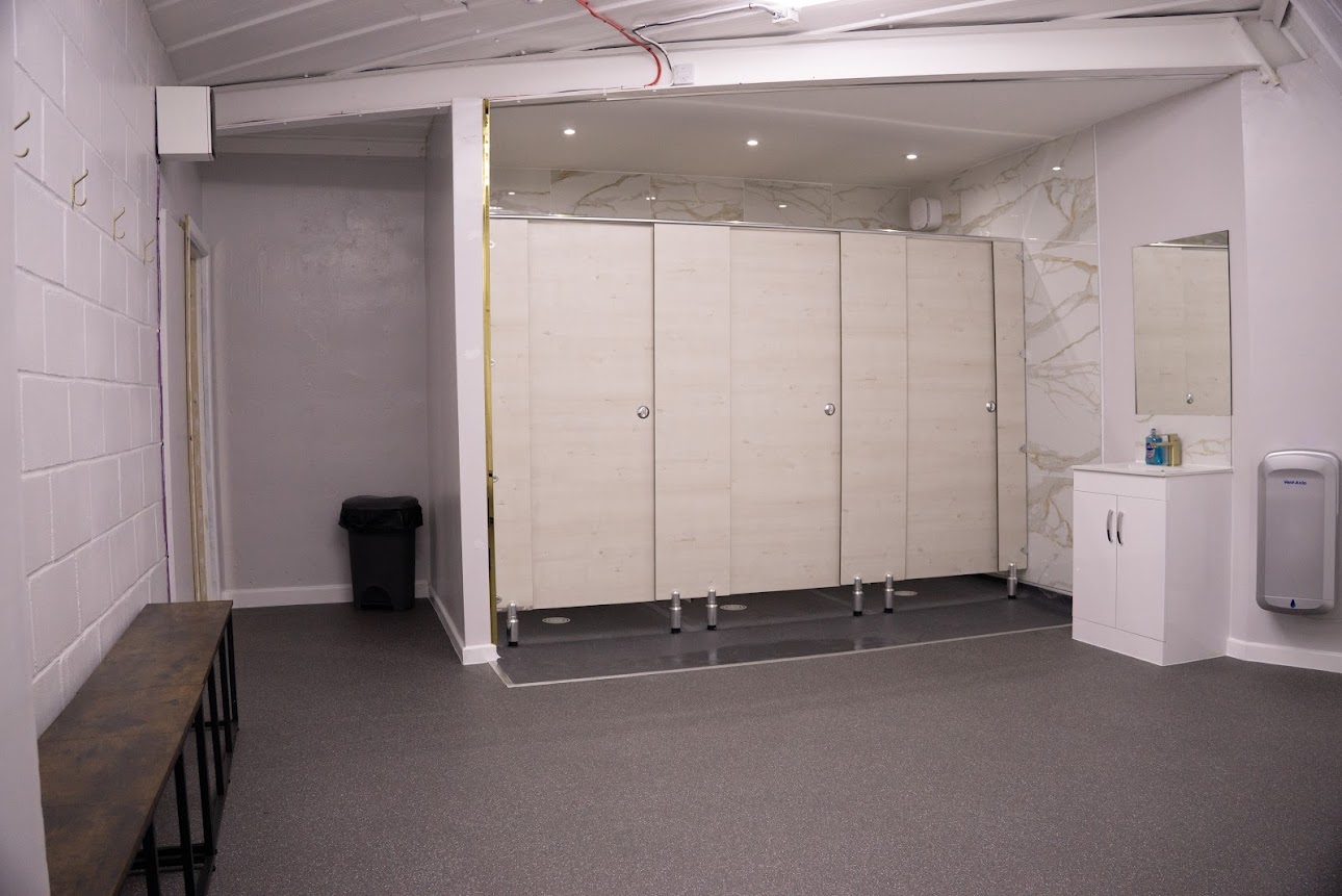 Shower cubicles and changing area with bench seating