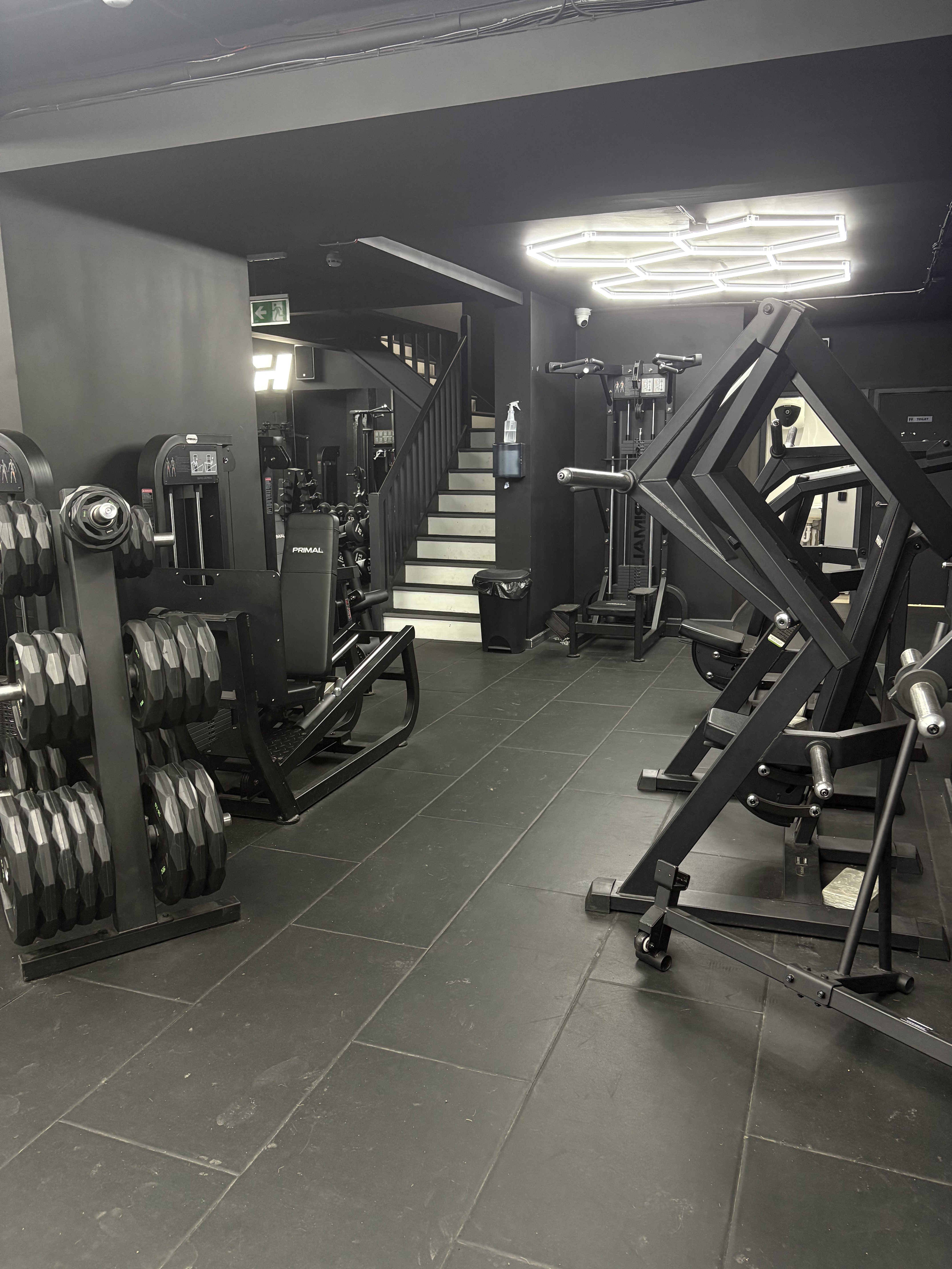 Dumbbell area with staircase to upper floor